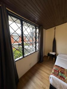 Cama o camas de una habitación en Bamuka Hostal