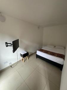 Cama o camas de una habitación en Bamuka Hostal