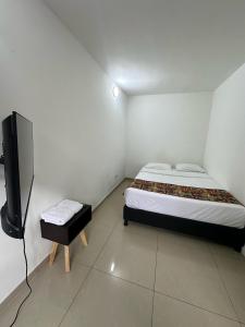 Cama o camas de una habitación en Bamuka Hostal