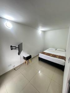 Cama o camas de una habitación en Bamuka Hostal