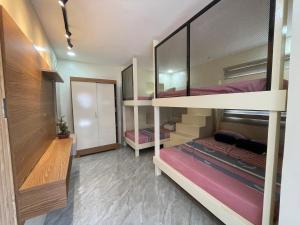 Ένα ή περισσότερα κρεβάτια σε δωμάτιο στο RMs Place