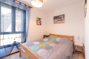 Ένα ή περισσότερα κρεβάτια σε δωμάτιο στο Appartement Gavarnie 8 Personnes