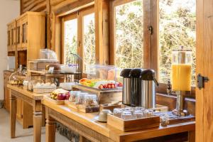 a kitchen with a bunch of food on a counter at Pousada Cachoeira da Barra in Cunha