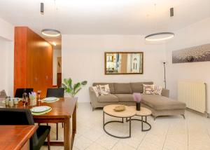 a living room with a couch and a table at Casa Di Aspa in Rethymno Town