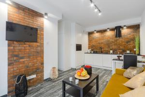 Kuchnia lub aneks kuchenny w obiekcie Lumina cozy apartments Manufaktura