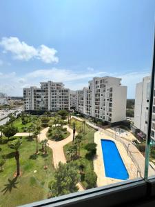a view of a large apartment complex with a swimming pool at Pearl Chic Stay Pool and View in Rabat