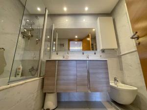 a bathroom with a shower and a sink and a toilet at Pearl Chic Stay Pool and View in Rabat +39 photos
