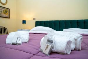 Postel nebo postele na pokoji v ubytování La Locanda del Geco