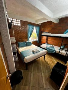 Postel nebo postele na pokoji v ubytování Hotel Mawill