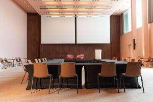 a conference room with a large table and chairs at Radisson Blu Resort & Spa in Split