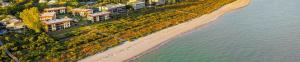 an aerial view of a beach next to the water at Direct beach access from your condo Sanibel Island 1A1 in Sanibel +3 photos