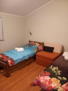 En eller flere senge i et værelse på Family Apartment Nelly + 40 billeder