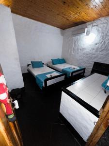 Postel nebo postele na pokoji v ubytování Hotel Mawill