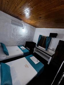 Postel nebo postele na pokoji v ubytování Hotel Mawill