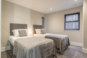 Bond House by Celador Apartments客房内的一张或多张床位