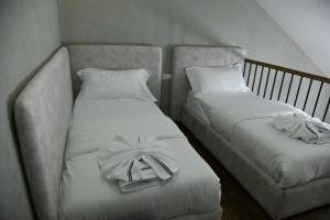 מיטה או מיטות בחדר ב-Hotel Valbor