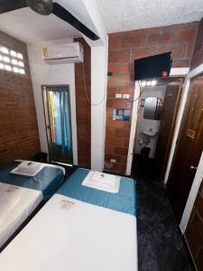 Postel nebo postele na pokoji v ubytování Hotel Mawill