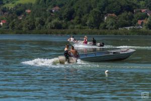 a group of people on boats in the water at Vikendica Vilcek in Mali Zvornik