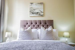 a bedroom with a large bed with white pillows at WhiskAwayHomes - Shaw Street - Apartment 5 in Worcester
