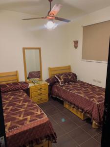 Ένα ή περισσότερα κρεβάτια σε δωμάτιο στο Porto Golf Sokhna