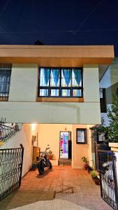 a motorcycle parked in front of a house at Elephant House - Boutique Hostel & CoWork in Méribel Village