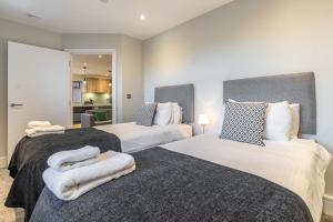 Bond House by Celador Apartments客房内的一张或多张床位