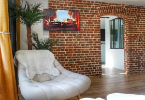 Posezení v ubytování Gîte Oasis Ault - Ciné, Balnéo & Confort à la Mer + 37 fotografií