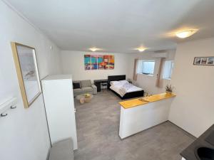 a living room with a couch and a table at Studio Rimac in Dubrovnik +13 photos