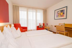 Postel nebo postele na pokoji v ubytování Allegria Resort Stegersbach - Allegria Hotel