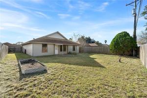 a yard with a house and a fence at 4 Bedroom 2 bath Beautiful spacious home for rent 1300 a month in Ingleside