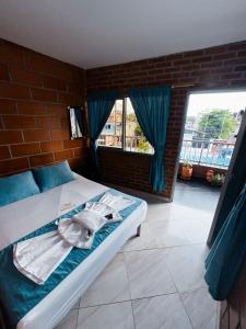 Postel nebo postele na pokoji v ubytování Hotel Mawill