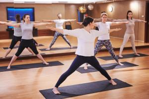 a group of people doing yoga in a dance class at Sheraton Sopot Hotel in Sopot
