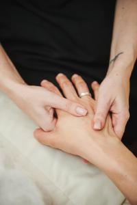two people putting their hands on top of each other at Sheraton Sopot Hotel in Sopot