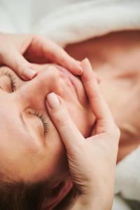 a woman putting her hands on her face at Sheraton Sopot Hotel in Sopot