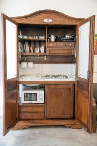 Kuchyň nebo kuchyňský kout v ubytování Casali Mediterranei Melissano by Palazzo Montagna + 39 fotografií