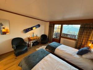 Voodi või voodid majutusasutuse Colorado Riders Chalet toas