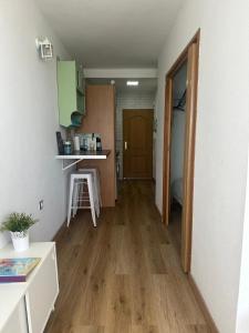 a room with a kitchen with a wooden floor at IRIVI 9 Apartment in Aguadulce