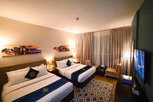 Letto o letti in una camera di Seven Seas Hotel