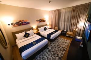 Letto o letti in una camera di Seven Seas Hotel