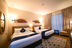 Letto o letti in una camera di Seven Seas Hotel