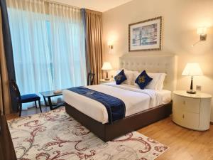 Letto o letti in una camera di Seven Seas Hotel