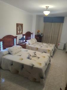 Łóżko lub łóżka w pokoju w obiekcie Pension A Barca