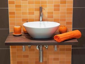 a white bowl sink on a shelf in a bathroom at Donsanto Casa Vacanze in Taormina +49 photos