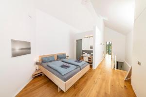 En eller flere senge i et værelse på Seglerwohnung 9