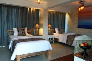 A bed or beds in a room at Bangsring Breeze
