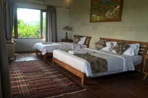 A bed or beds in a room at Bangsring Breeze