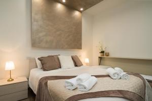 Postel nebo postele na pokoji v ubytování MaisonLuVì