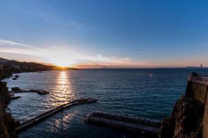 a sunset over a body of water at Hotel Crawford in Sant'Agnello