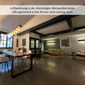 a living room with a table and a dining room at KORN14 Loft - Parken, Küche in Freinsheim