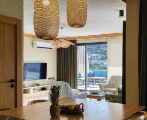 a living room with a table with a pineapple on it at Captivating Casa La Calypso in Kas